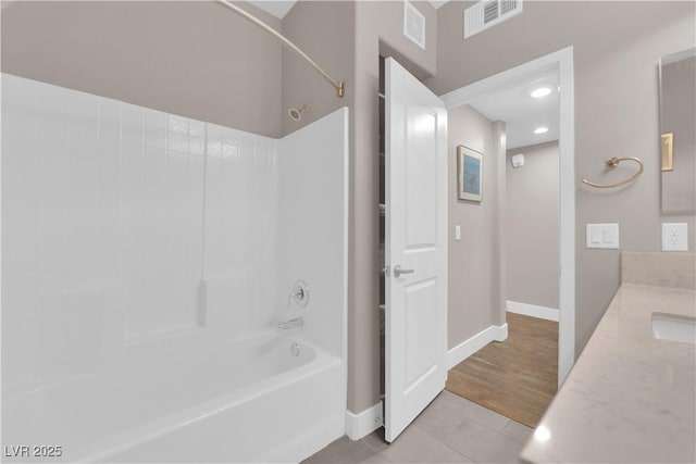 bathroom with vanity, tile patterned floors, and shower / bathtub combination