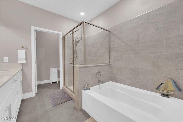 bathroom featuring vanity, separate shower and tub, and tile patterned flooring