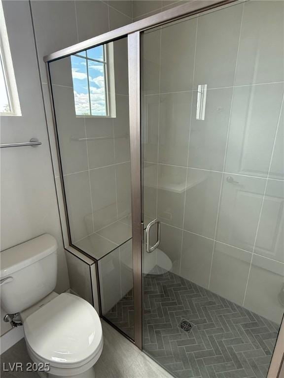 4630 Blushing Dawn Ave, Las Vegas, NV 89118 - bathroom featuring a stall shower and toilet