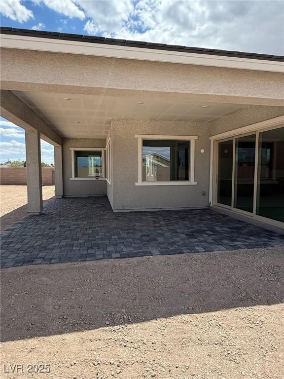 4630 Blushing Dawn Ave, Las Vegas, NV 89118 - back of house with a patio and stucco siding