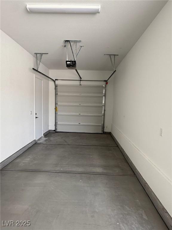 4630 Blushing Dawn Ave, Las Vegas, NV 89118 - garage featuring a garage door opener and baseboards