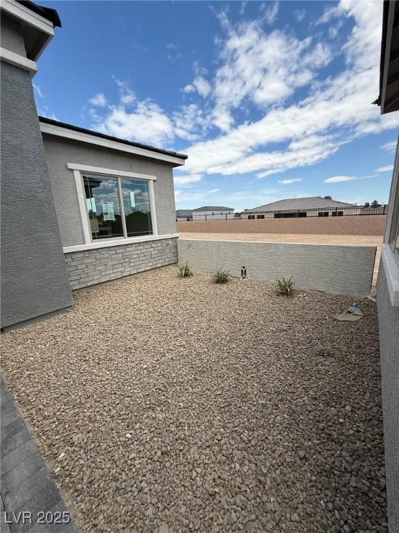 4630 Blushing Dawn Ave, Las Vegas, NV 89118 - view of yard featuring fence