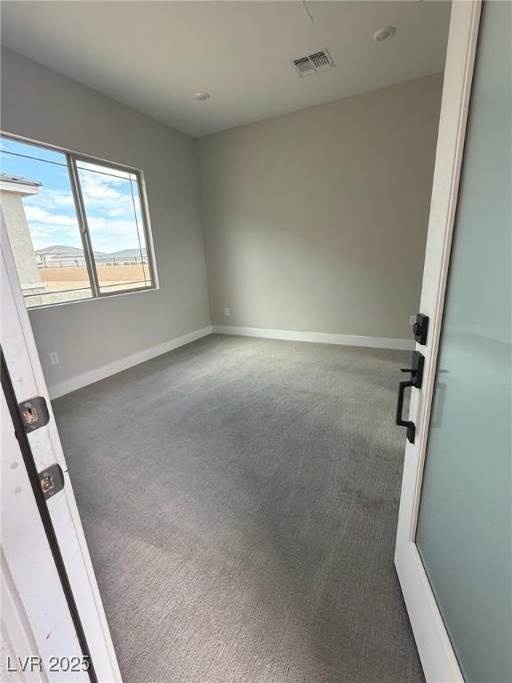 4630 Blushing Dawn Ave, Las Vegas, NV 89118 - spare room featuring carpet floors and baseboards