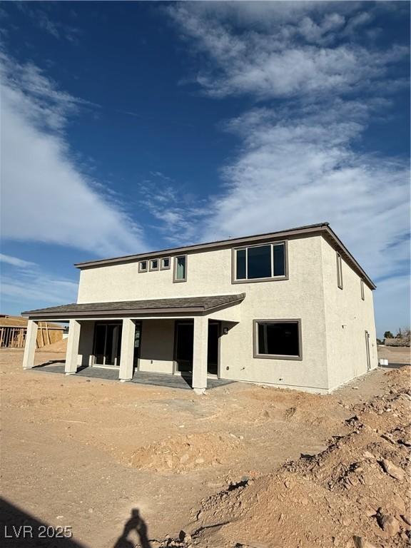 rear view of property with a patio area