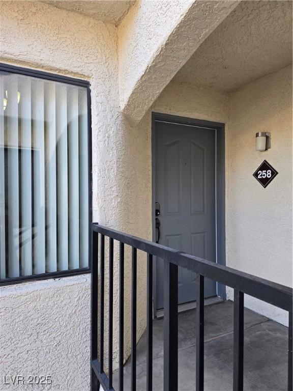 doorway to property with a balcony