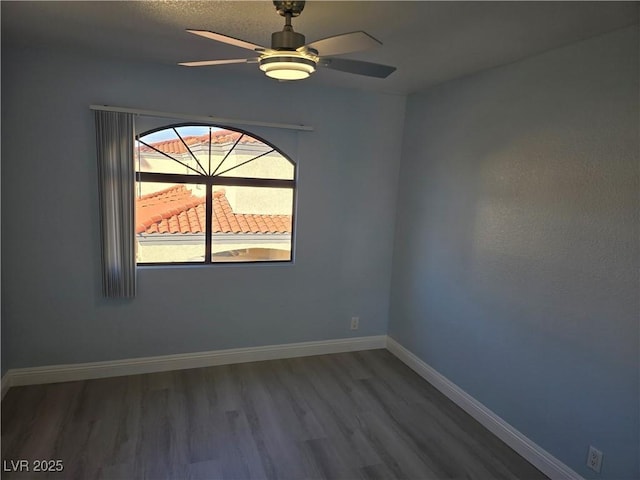 empty room featuring wood-type flooring and ceiling fan