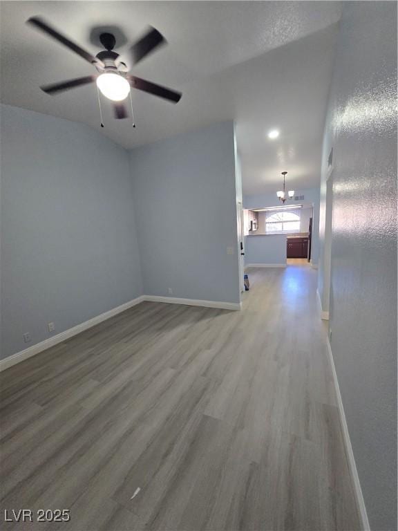 empty room featuring hardwood / wood-style flooring and ceiling fan