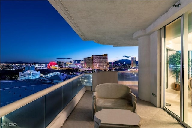 view of balcony at dusk