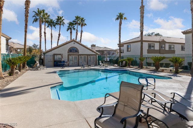 view of swimming pool with a patio