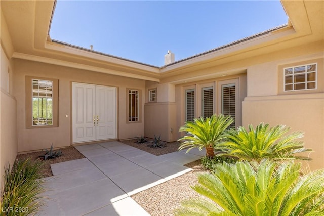 entrance to property featuring a patio area