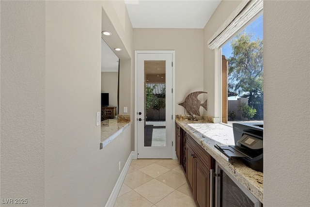 entryway with light tile patterned flooring