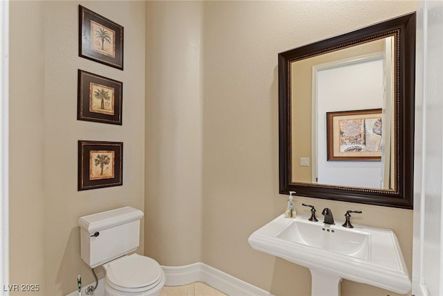 bathroom with sink and toilet