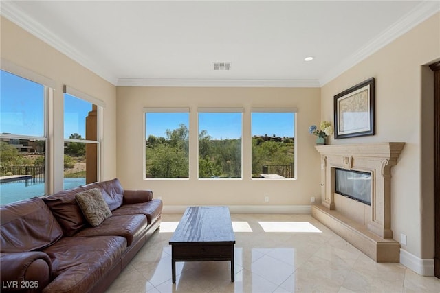 living room featuring crown molding and a fireplace