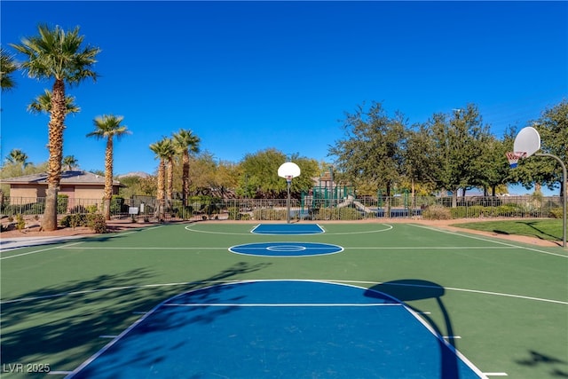 view of sport court featuring a playground