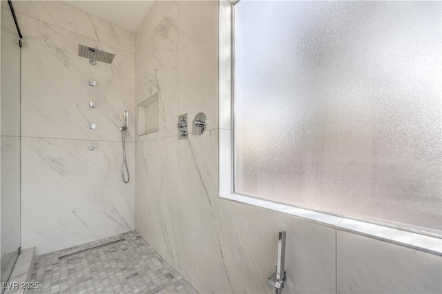 full bath featuring a marble finish shower