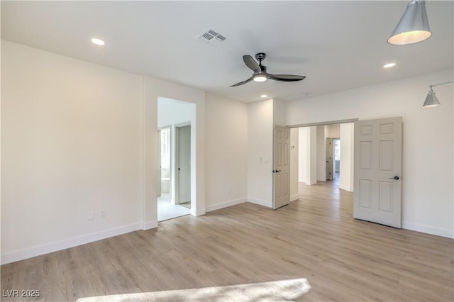 unfurnished bedroom with recessed lighting, visible vents, baseboards, light wood finished floors, and ensuite bath