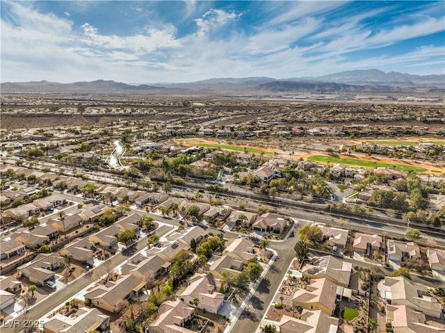 birds eye view of property with a residential view and a mountain view