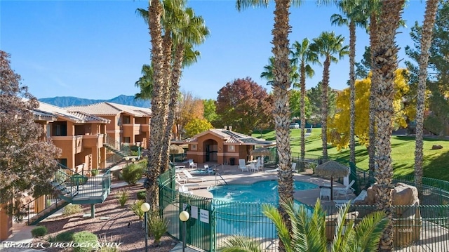 view of pool featuring a mountain view and a patio area