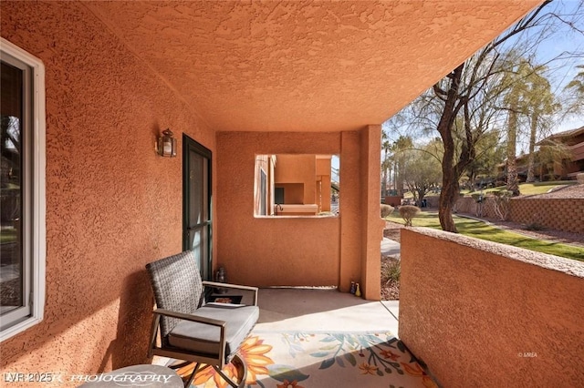 view of patio featuring a balcony