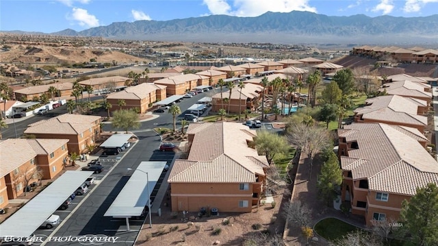 birds eye view of property featuring a mountain view