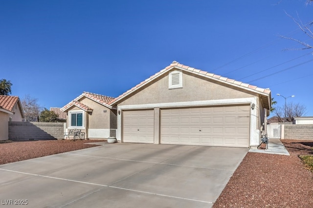 ranch-style home with a garage