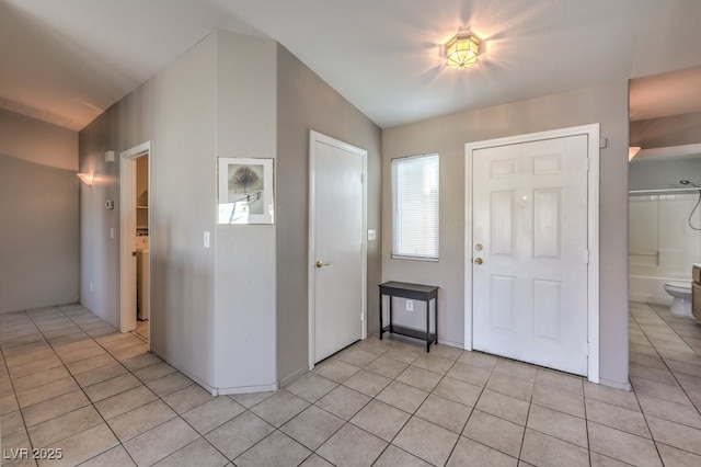 entryway featuring light tile patterned floors