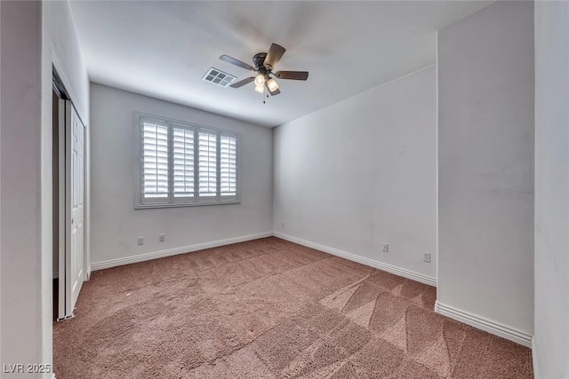 unfurnished bedroom with carpet, ceiling fan, and a closet