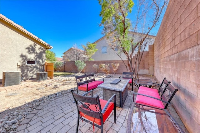 view of patio featuring an outdoor living space and central AC unit