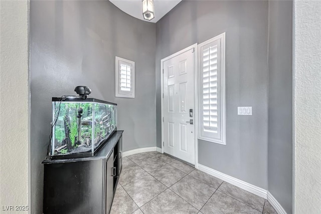 foyer entrance with light tile patterned flooring