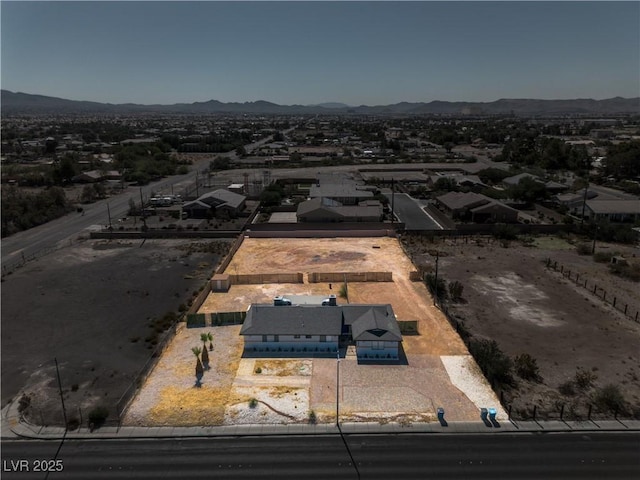 birds eye view of property featuring a mountain view