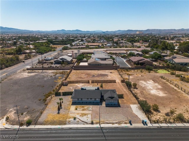 birds eye view of property featuring a mountain view