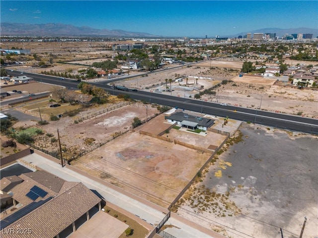 birds eye view of property with a mountain view