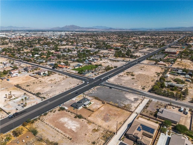 birds eye view of property featuring a mountain view