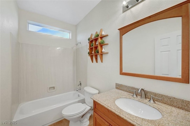 bathroom featuring toilet, vanity, and bathing tub / shower combination