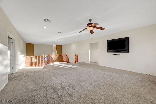 unfurnished room with ceiling fan, recessed lighting, carpet flooring, visible vents, and baseboards