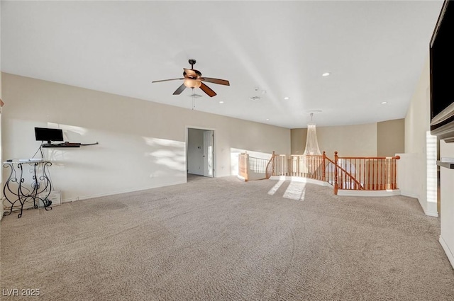 empty room featuring light carpet, baseboards, a ceiling fan, and recessed lighting