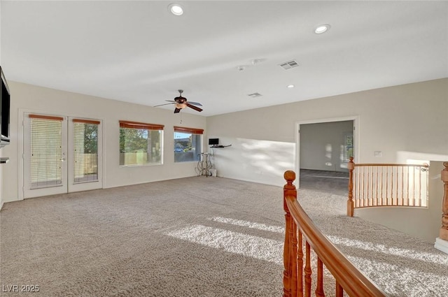 carpeted spare room with visible vents, a ceiling fan, and recessed lighting