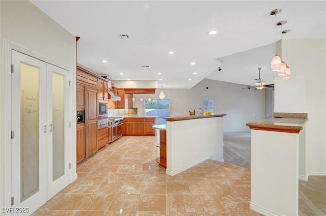 kitchen featuring visible vents, brown cabinetry, a peninsula, pendant lighting, and recessed lighting