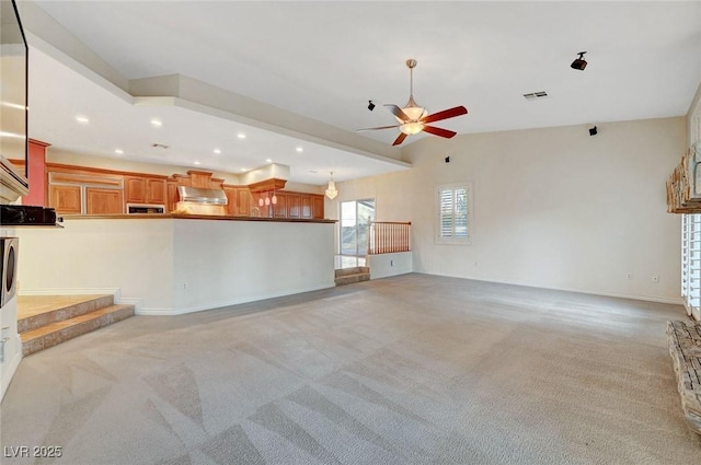 unfurnished living room featuring recessed lighting, light colored carpet, visible vents, a ceiling fan, and baseboards