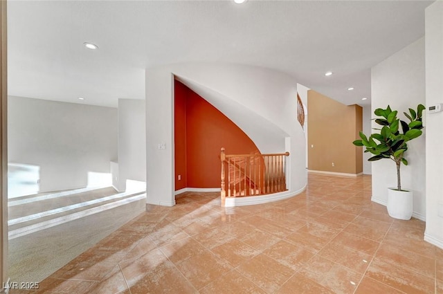 bonus room featuring baseboards and recessed lighting