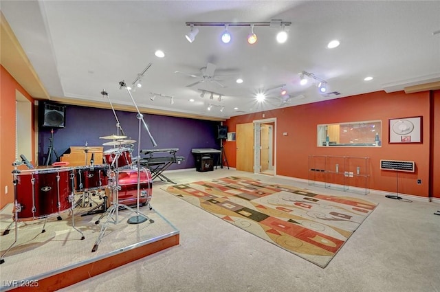 rec room with rail lighting, ceiling fan, visible vents, and light colored carpet