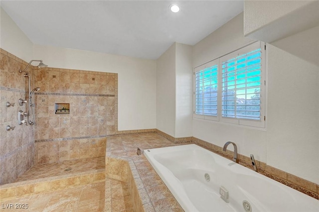 bathroom featuring tiled shower and a whirlpool tub