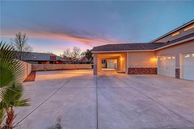 exterior space with fence and driveway