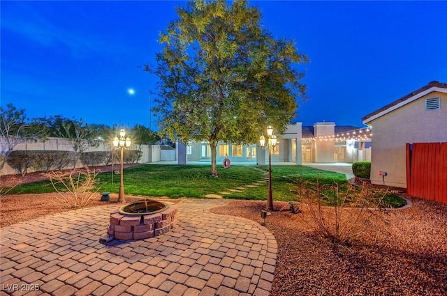 surrounding community with an outdoor fire pit, fence, a lawn, and a patio