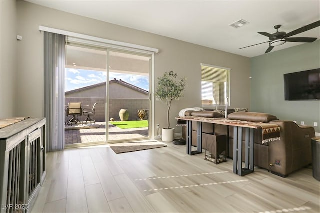 misc room with ceiling fan and light hardwood / wood-style flooring