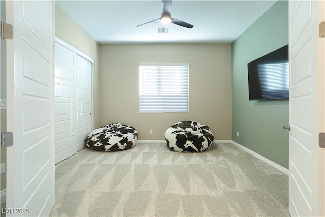 unfurnished room with ceiling fan and carpet flooring