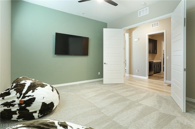 unfurnished bedroom featuring ceiling fan and light carpet