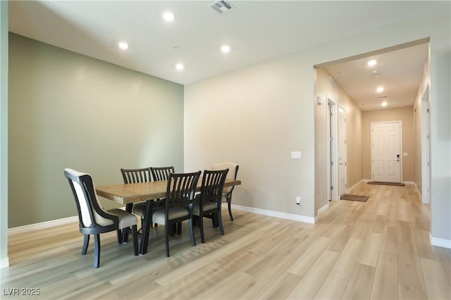 dining room with light wood-type flooring