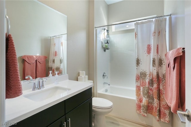 full bathroom featuring vanity, shower / bathtub combination with curtain, and toilet