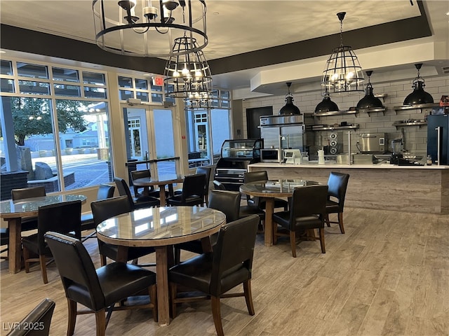 dining room featuring a notable chandelier and wood-type flooring